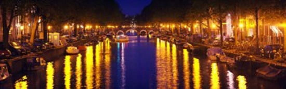 Canal at night Amsterdam Netherlands Canvas Art - Panoramic Images (36 x 12)