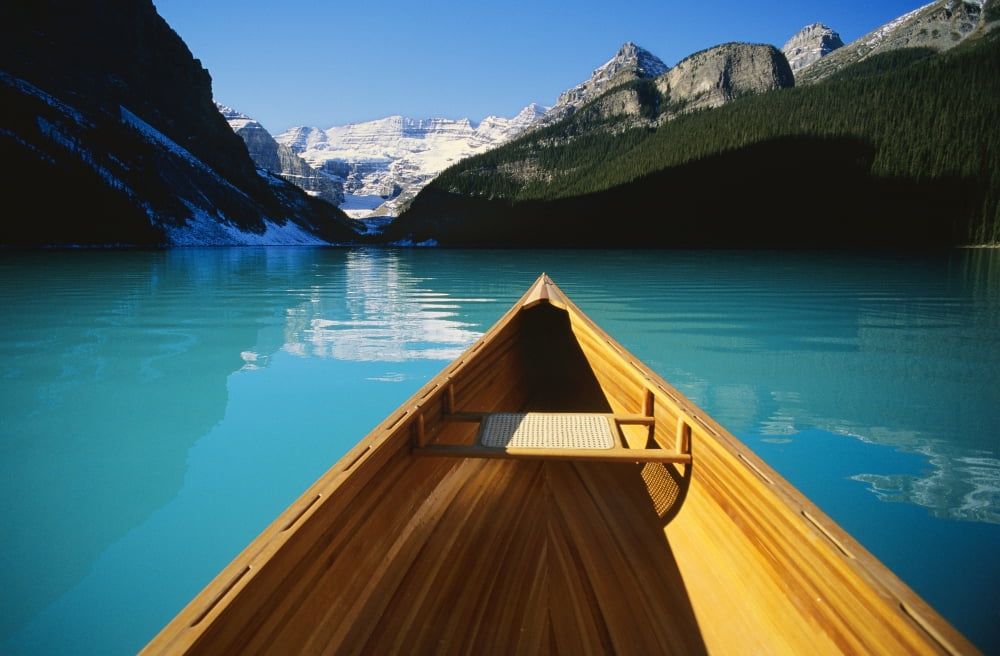 Canoe On Lake Louise In Alberta Canada Canvas Art - Bilderbuch Design Pics (36 x 22)