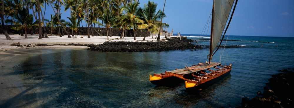 Canoe in the sea HonoluluPuuhonua o Honaunau National Historical Park Honaunau Hawaii USA Canvas Art - Panoramic Images (36 x 12)