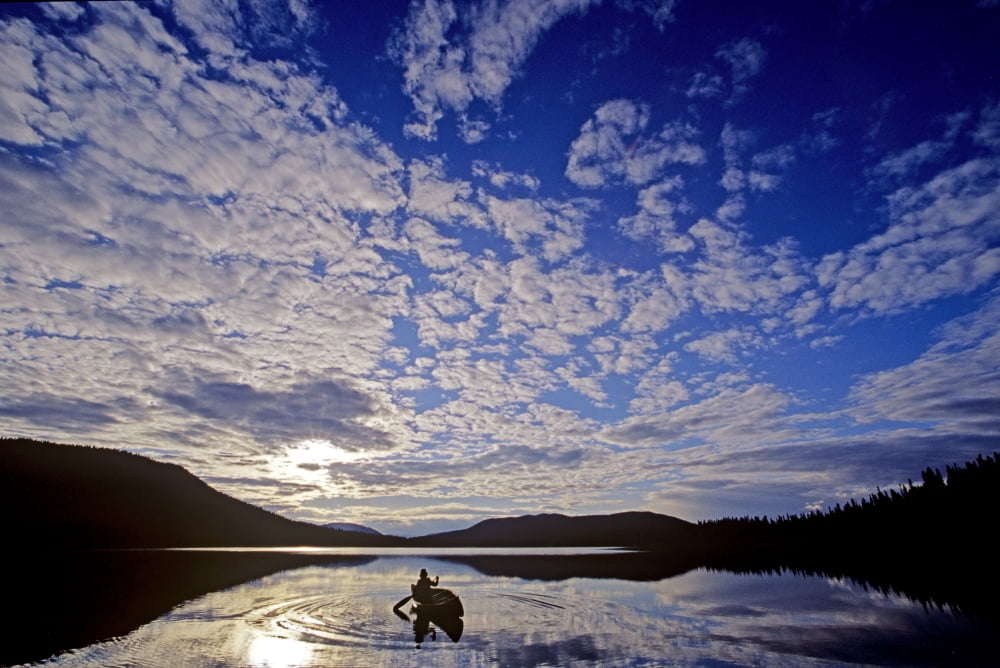 Canoeist And Cloudy Sky Bowron Lake Park British Columbia Canvas Art - Chris Harris Design Pics (34 x 22)