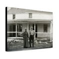 thumbnail image 1 of Canvas Print: Captain Tate And Wife Standing In Front Of The Kitty Hawk Post, 1 of 3