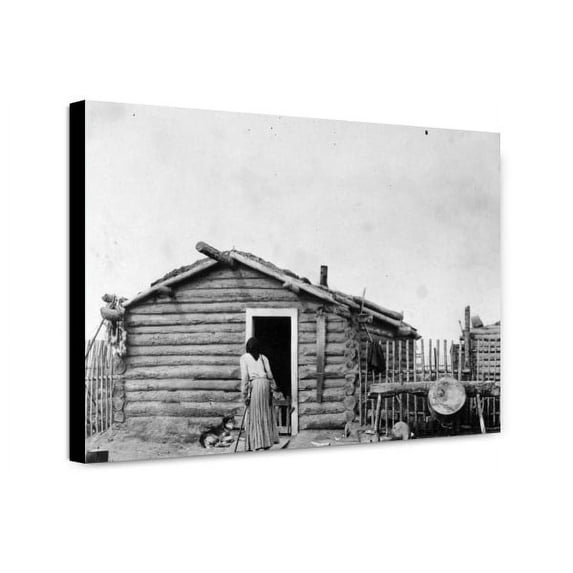 Canvas Print: Woman And Dog Outside Log Cabin, circa 1900