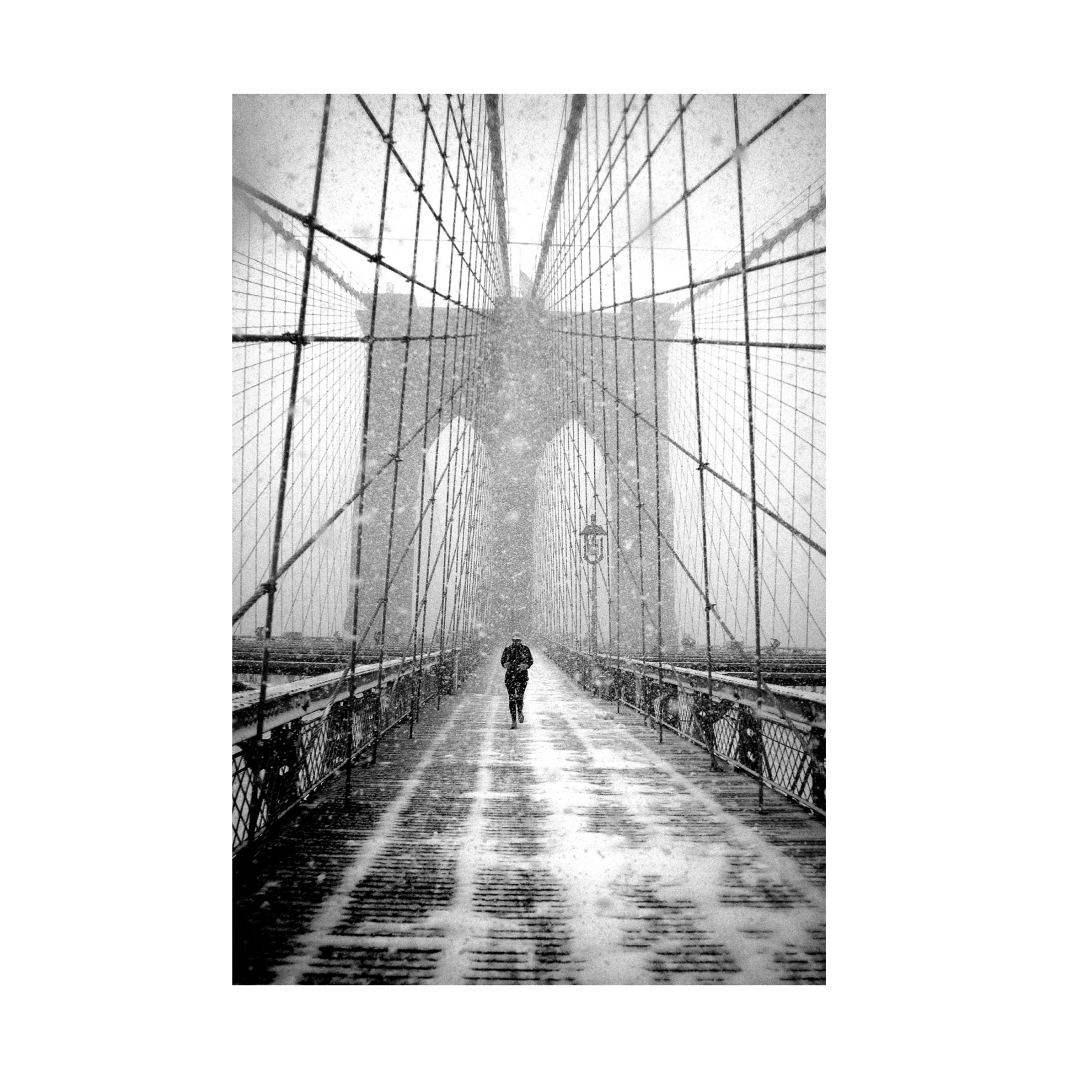 Canvas Wall Art - Martin Froyda 'New York Walker In Blizzard - Brooklyn Bridge' Wall Art for Living Room, Bedroom, or Office Décor by Trademark Fine Art - 22 x 32 Inches