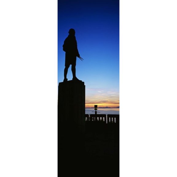 Captain Cook monument silhouetted by sunset, Anchorage, Alaska, USA. Poster Print (18 x 7)