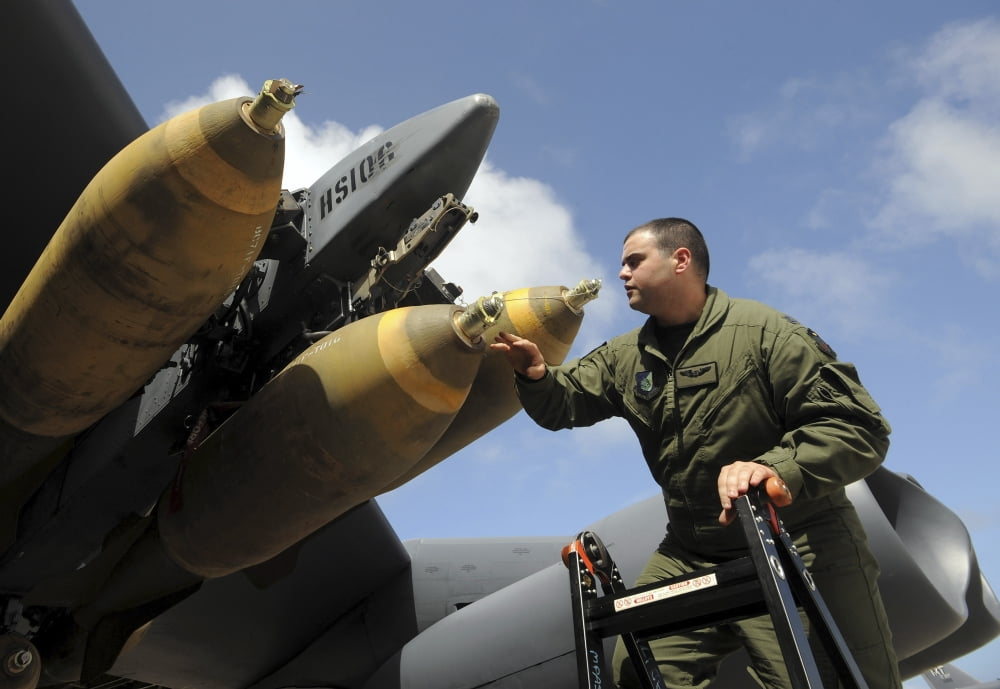 Captain inspects the M-117 ordnance on his B-52 Stratofortress Canvas Art - Stocktrek Images (34 x 24)