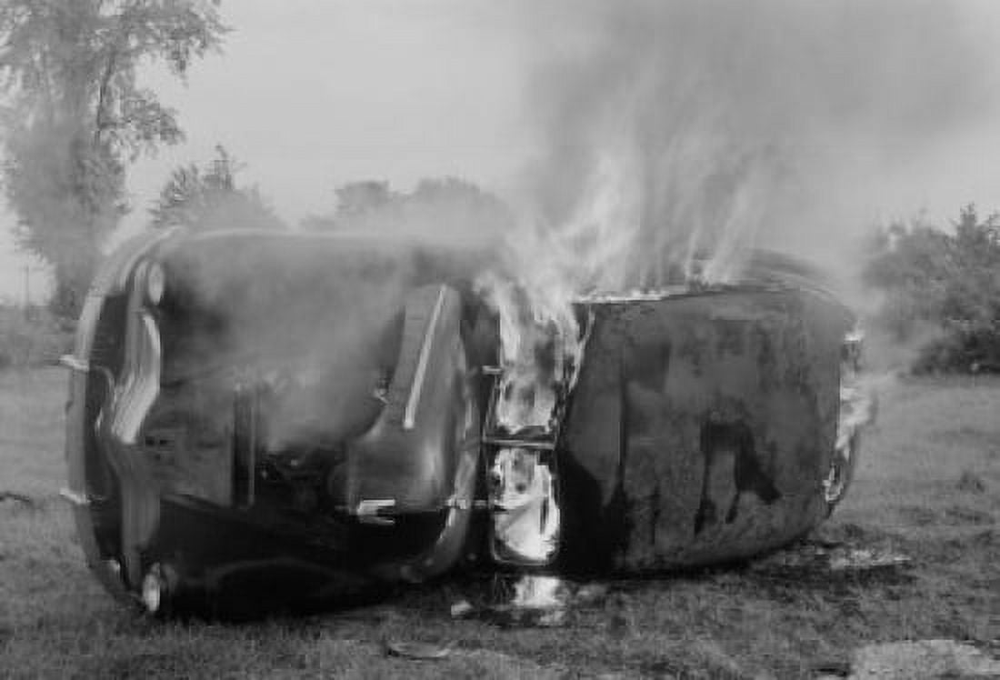 Car on fire in field Canvas Art - (24 x 36)