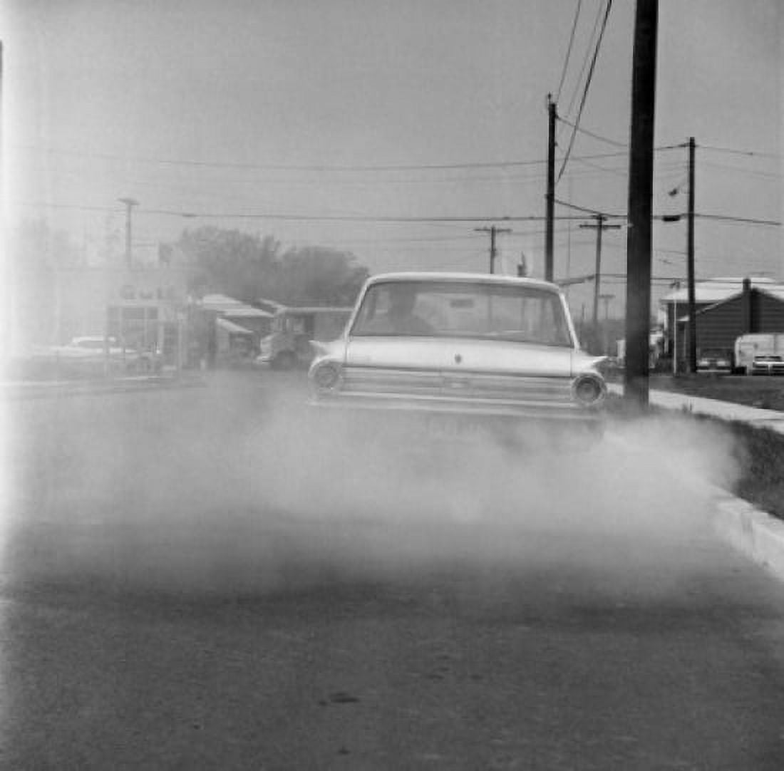 Car smoking on the road Canvas Art - (18 x 24)