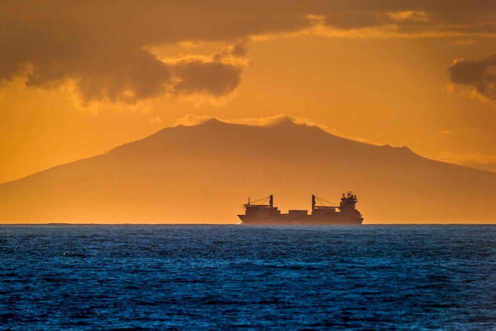 Cargo Ship at sunset with Snaefellsjokull Glacier in the background Snaefellsnes Peninsula Iceland Canvas Art - Panoramic Images (36 x 12)