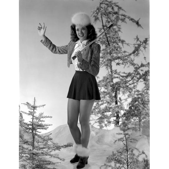 Carol Forman wearing a Blazer and Skirt with Furry Shoes Photo Print (8 x 10)