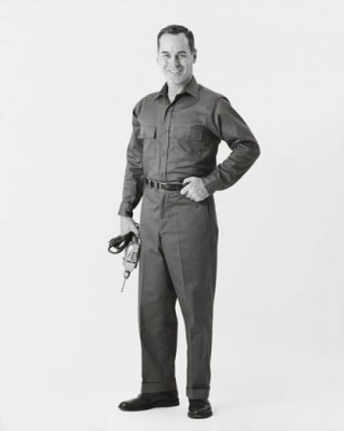 Carpenter holding a drill and smiling Canvas Art - (18 x 24)
