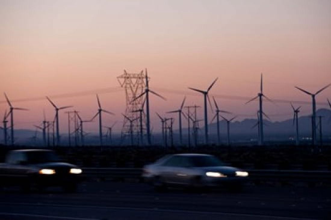 Cars moving on road with wind turbines in background at dusk Palm Springs Riverside County California USA Canvas Art - Panoramic Images (36 x 24)