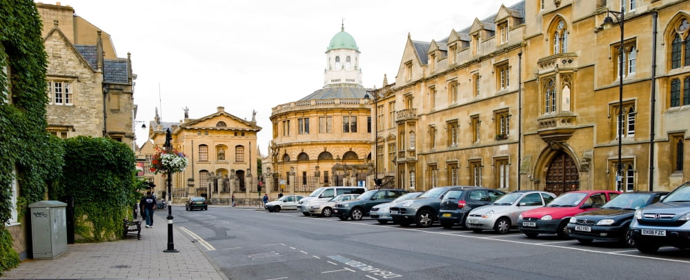 Cars parked in a street Oxford Oxfordshire England Canvas Art - Panoramic Images (27 x 9)