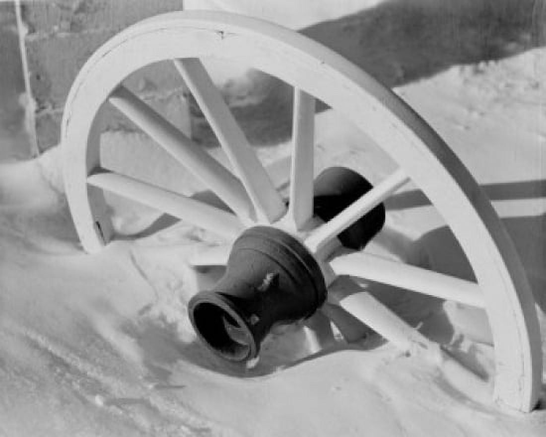 Cart wheel partially buried in snow Canvas Art - (24 x 36)