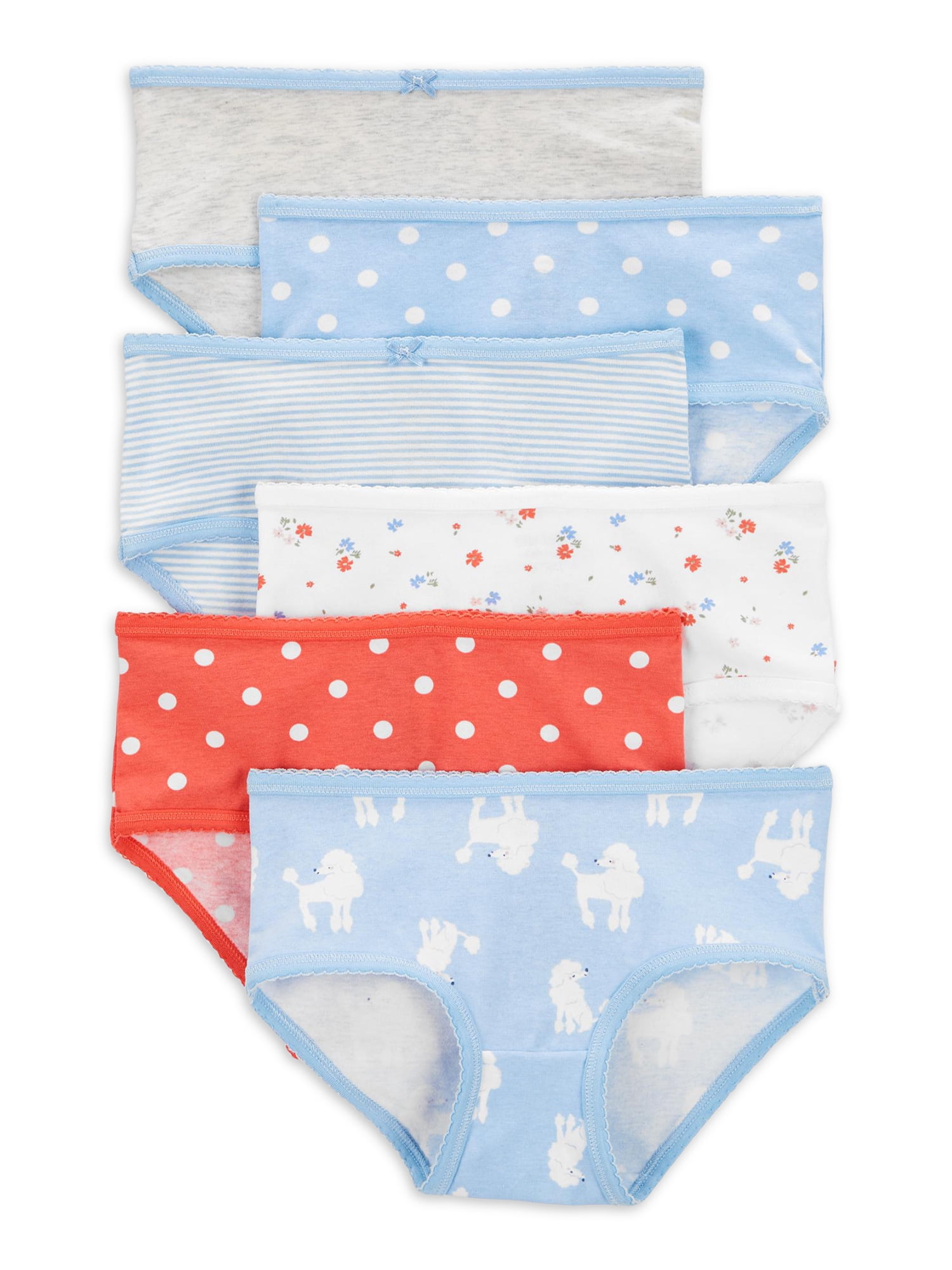 A lot of children's underwear. Knitted baby clothes as a background.  Underwear in the form of panties and T-shirts for children. Delicate  clothes for girls and boys. Stock Photo