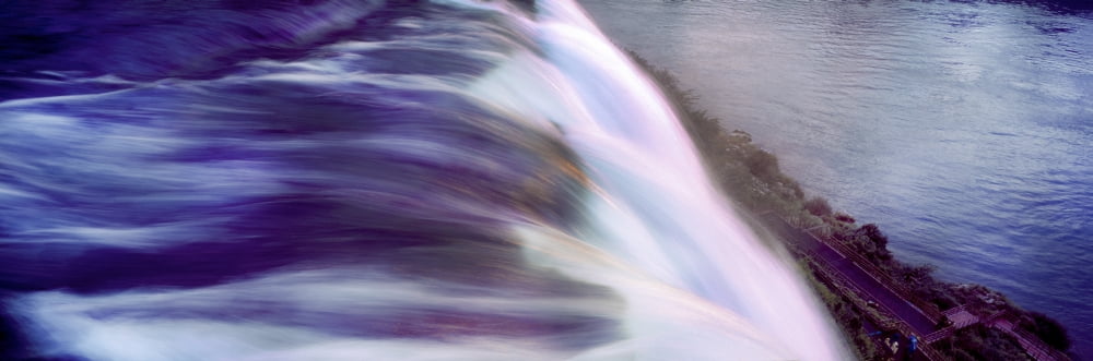 Cascading water over the falls Niagara Falls Ontario Canada Canvas Art - Panoramic Images (36 x 12)