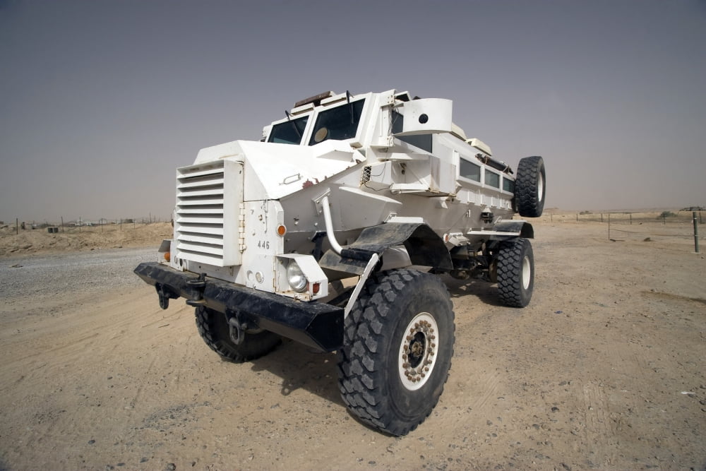 Casper armored vehicle sits outside the wire at the entrance to Al Asad Marine Camp Canvas Art - Terry MooreStocktrek Images (17 x 12)