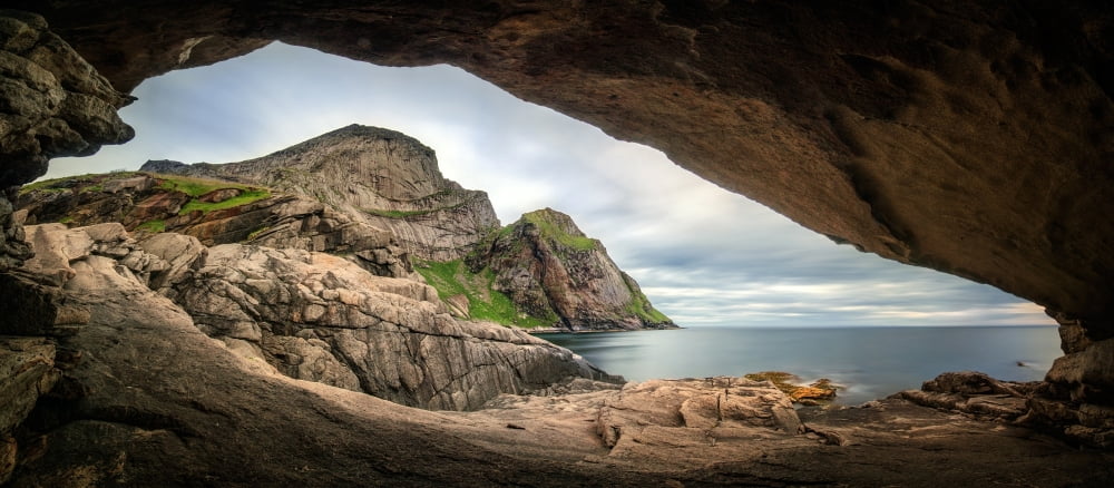 Cave at coast Bunes Beach Lofoten Nordland Norway Canvas Art - Panoramic Images (14 x 30)
