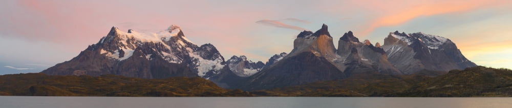 Cerro Paine Grande (L) and the Cuernos del Paine (R) at sunrise from Lake Pehoe Torres Del Paine National Park Chile Canvas Art - Panoramic Images (22 x 5)