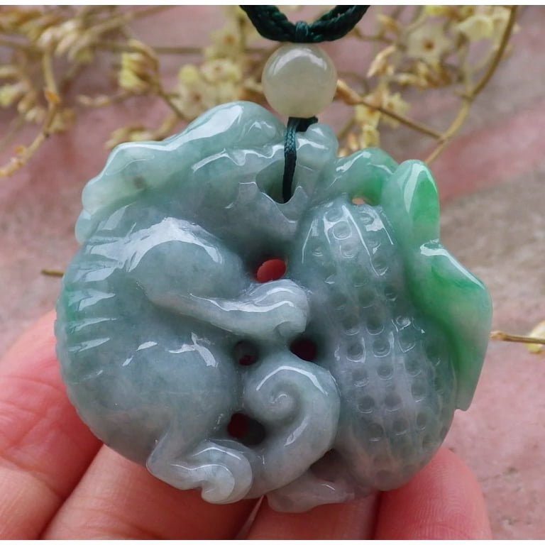 Carved jadeite pendant deals