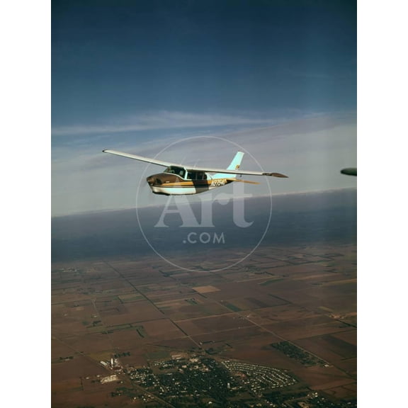 Cessna 210 Centurion Flying, Unframed Photographic Print Wall Art Sold by Art.Com