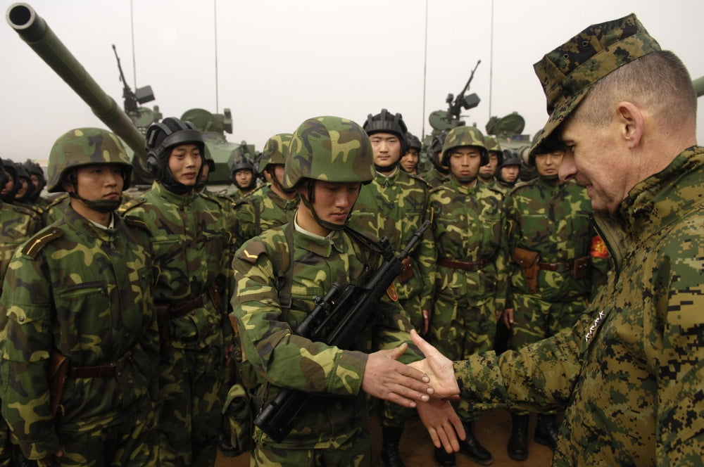 Chairman of the Joint Chiefs of Staff shakes hands with Chinese tanker soldier Canvas Art - Stocktrek Images (35 x 23)