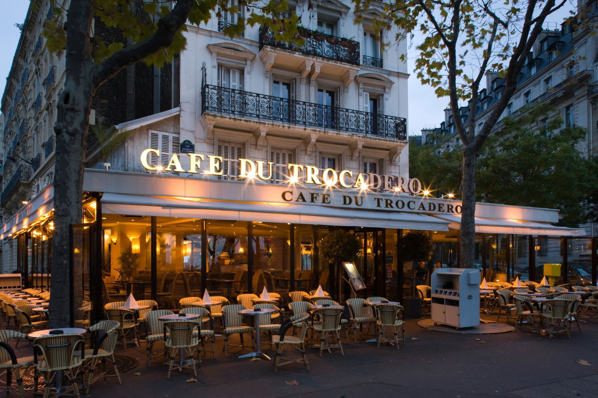 Chairs and tables in a restaurant at dawn Cafe Du Trocadero Paris Ile-de-France France Canvas Art - Panoramic Images (27 x 9)