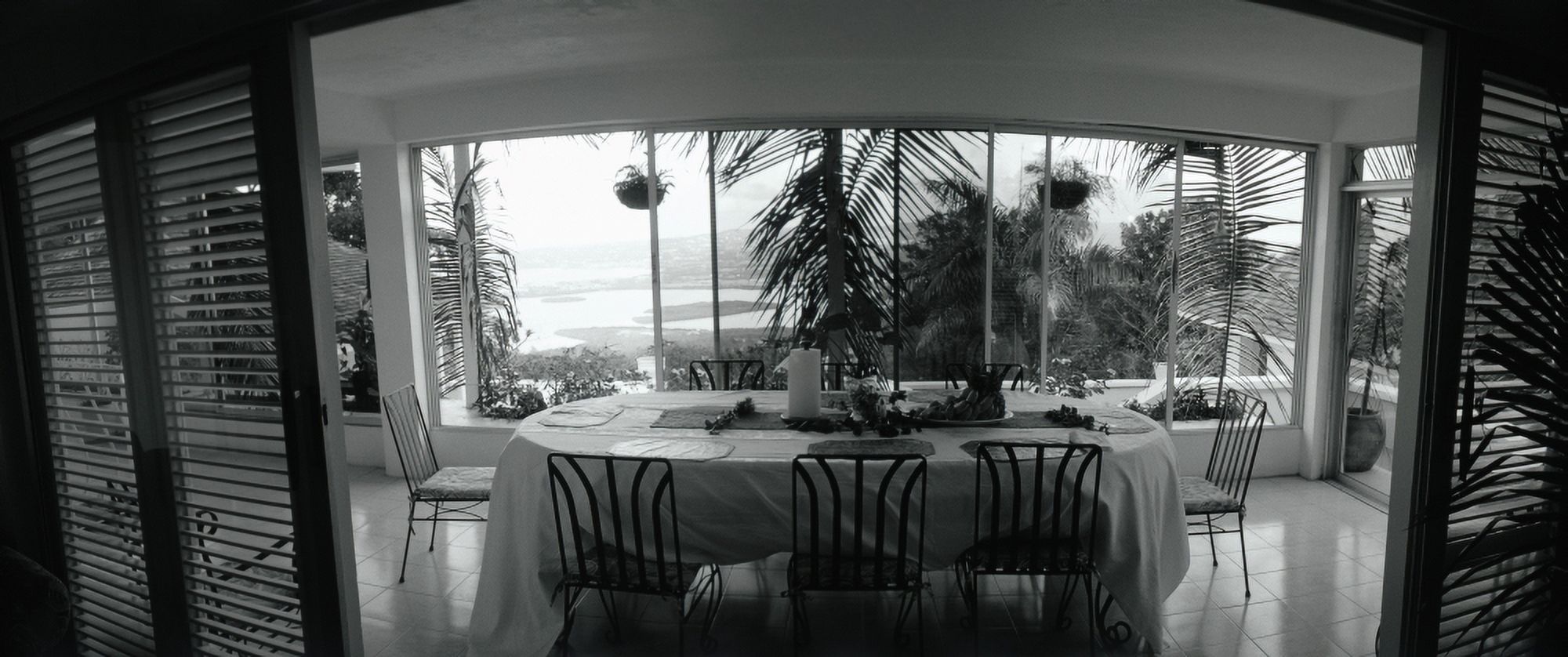 Chairs around a dining table Montego Bay Jamaica Canvas Art - Panoramic Images (27 x 9)