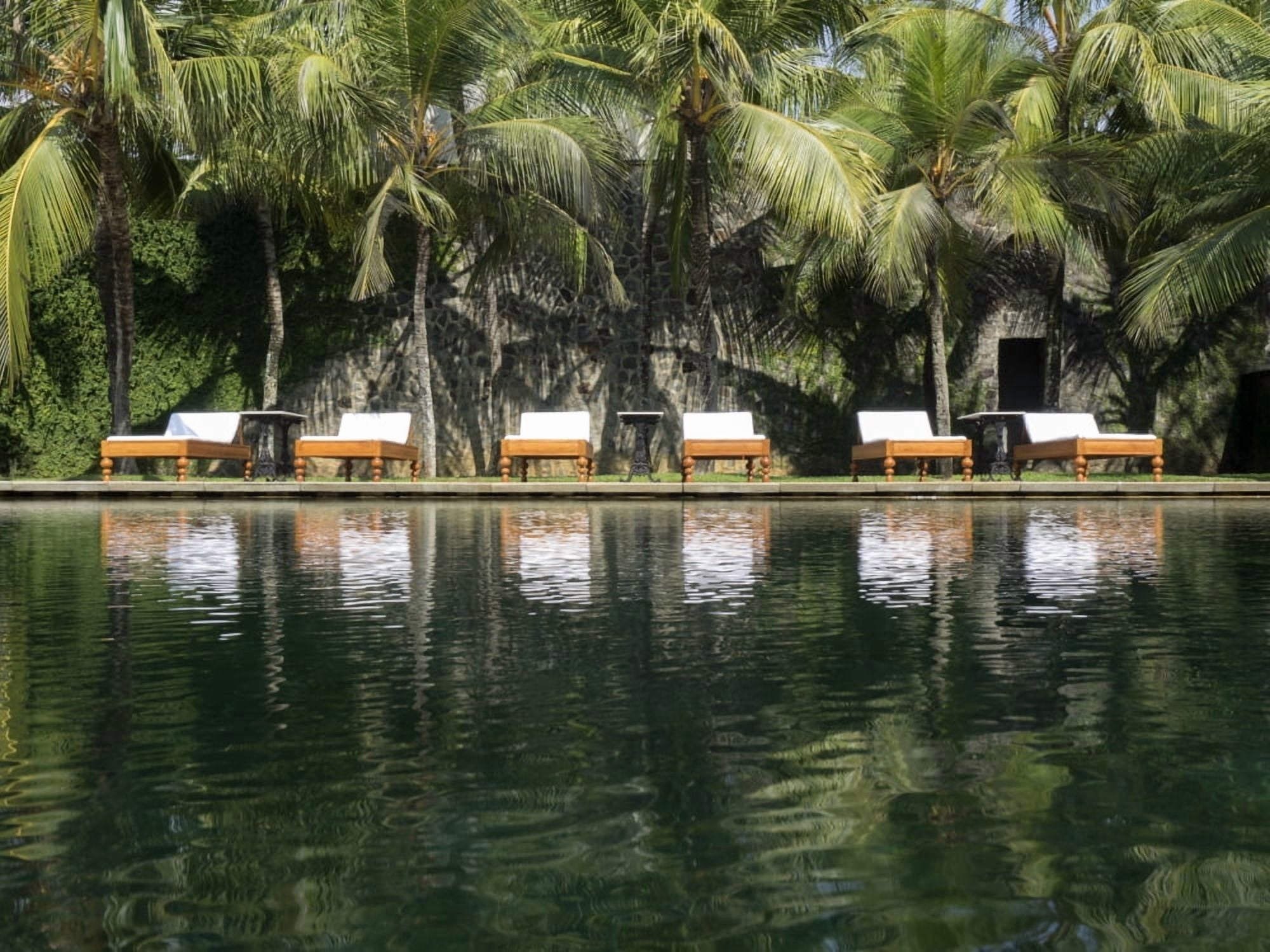 Chaise lounger reflected in pool at Amangalla Hotel Galle Fort Galle Southern Province Sri Lanka Canvas Art - Panoramic Images (12 x 16)