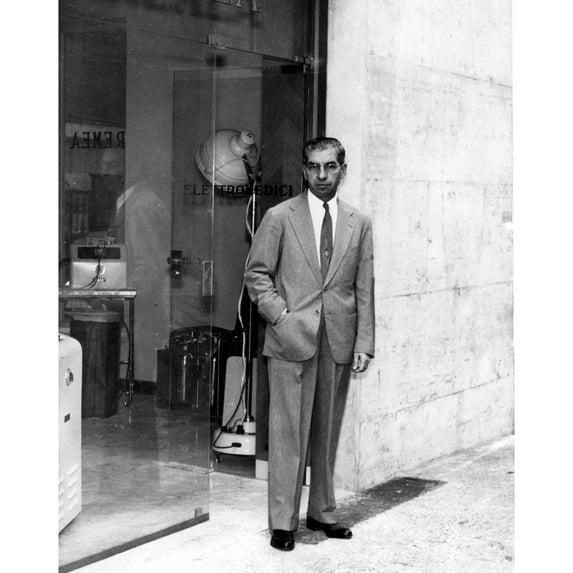 Charles Lucky Luciano Standing In Front Of His Electrical Medical Appliances Shop In Naples History