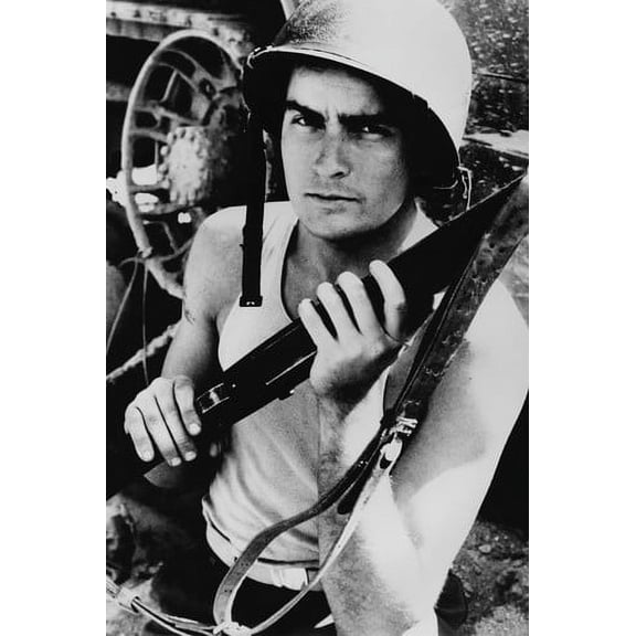 Charlie Sheen in Platoon in vest and helmet holding rifle 24x36 Poster