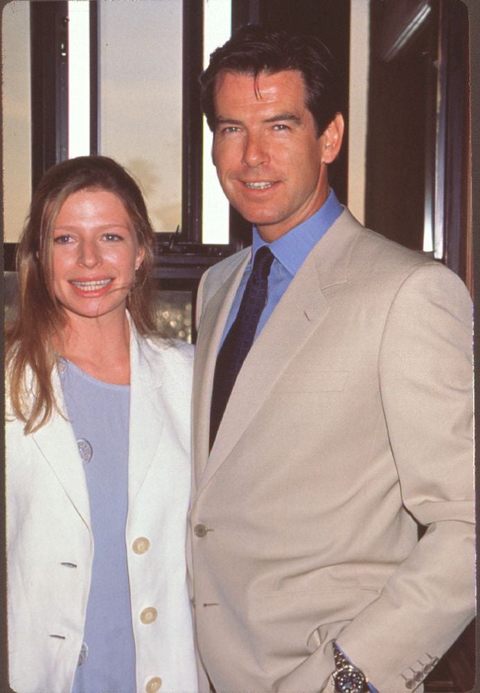 Charlotte Brosnan In Blue Top And White Jacket With Pierce Brosnan In