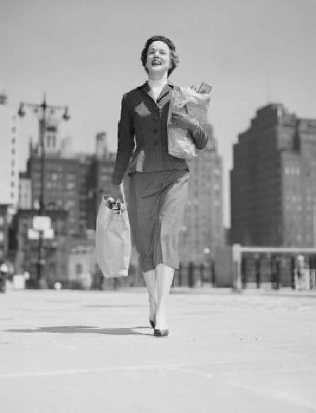 Cheerful businesswoman carrying shopping bags Canvas Art - (24 x 36)