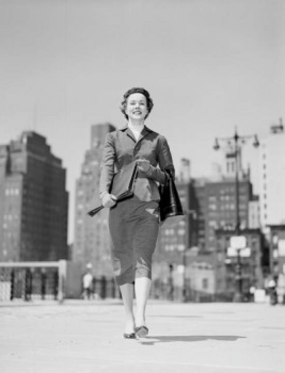 Cheerful businesswoman walking in downtown Canvas Art - (18 x 24)