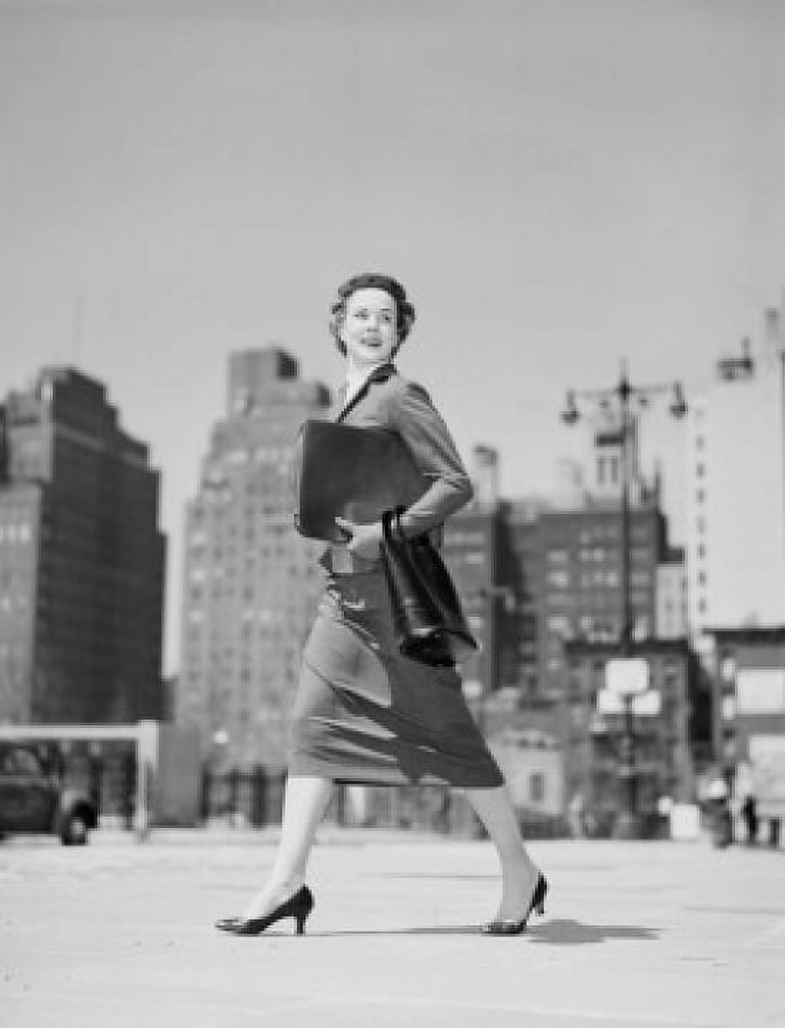Cheerful businesswoman walking in downtown Canvas Art - (24 x 36)