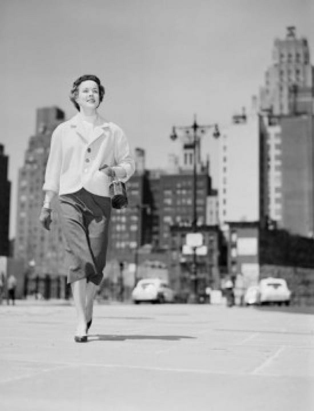 Cheerful businesswoman walking in downtown Canvas Art - (24 x 36)