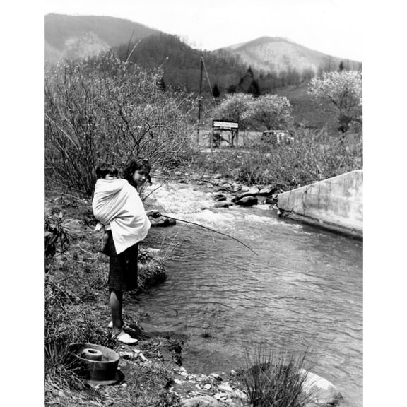 Cherokee Indian-Cherokee Indian Woman Using A Willow Switch And A Bent Pin To Fish. North Carolina Cherokee Reservation
