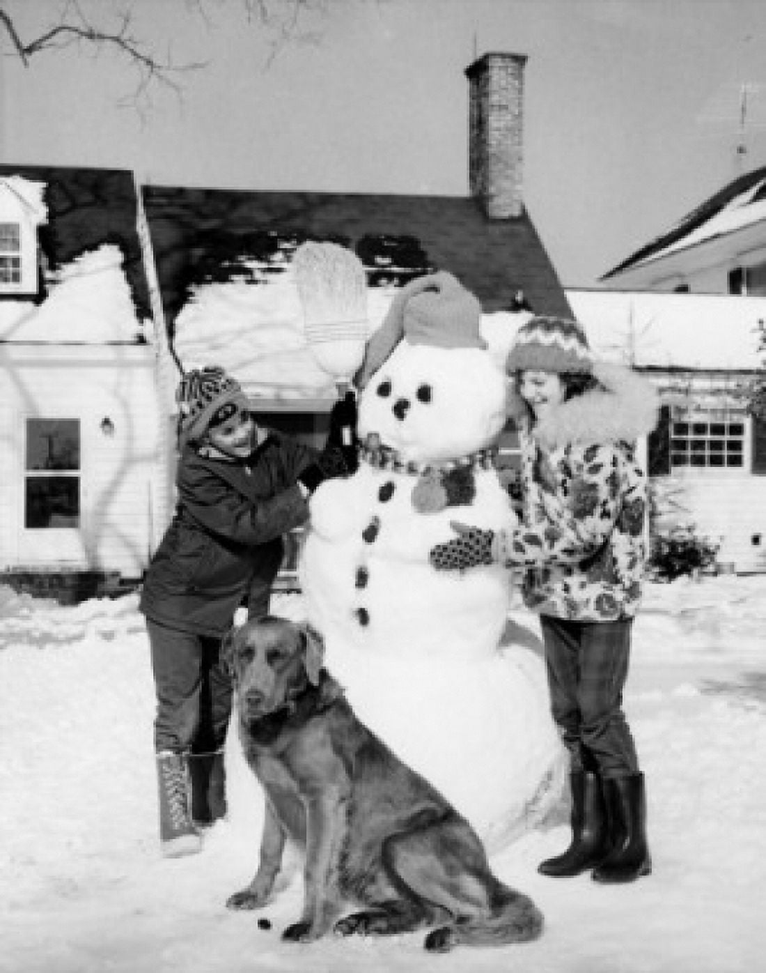 Children making snowman in back yard Canvas Art - (24 x 36)