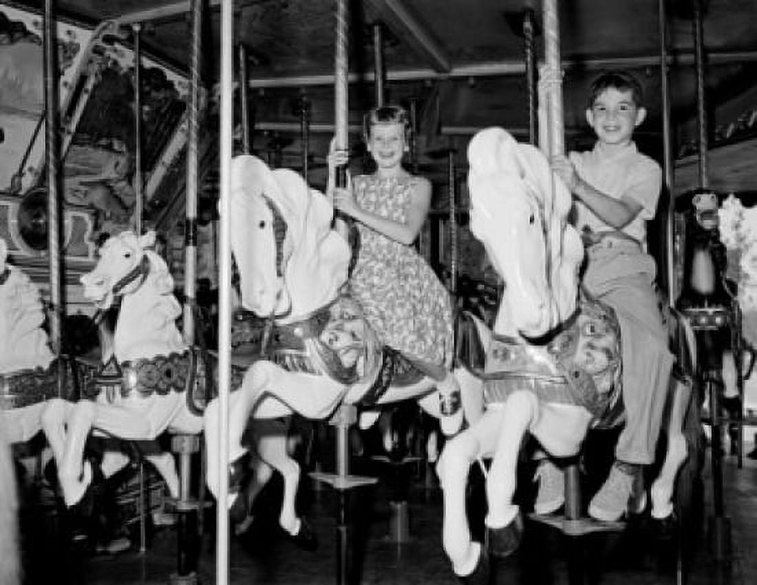 Children on carousel Canvas Art - (24 x 36)
