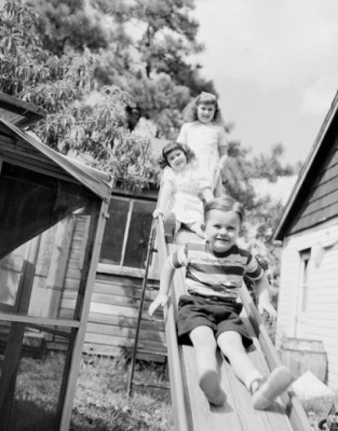 Children on slide Canvas Art - (18 x 24)
