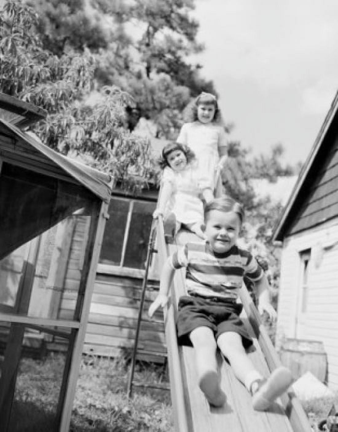 Children on slide Canvas Art - (24 x 36)