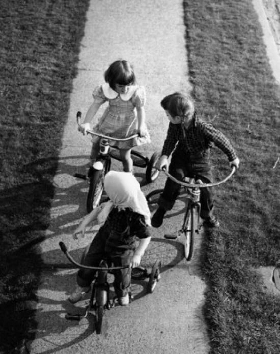 Children on tricycles Canvas Art - (18 x 24)