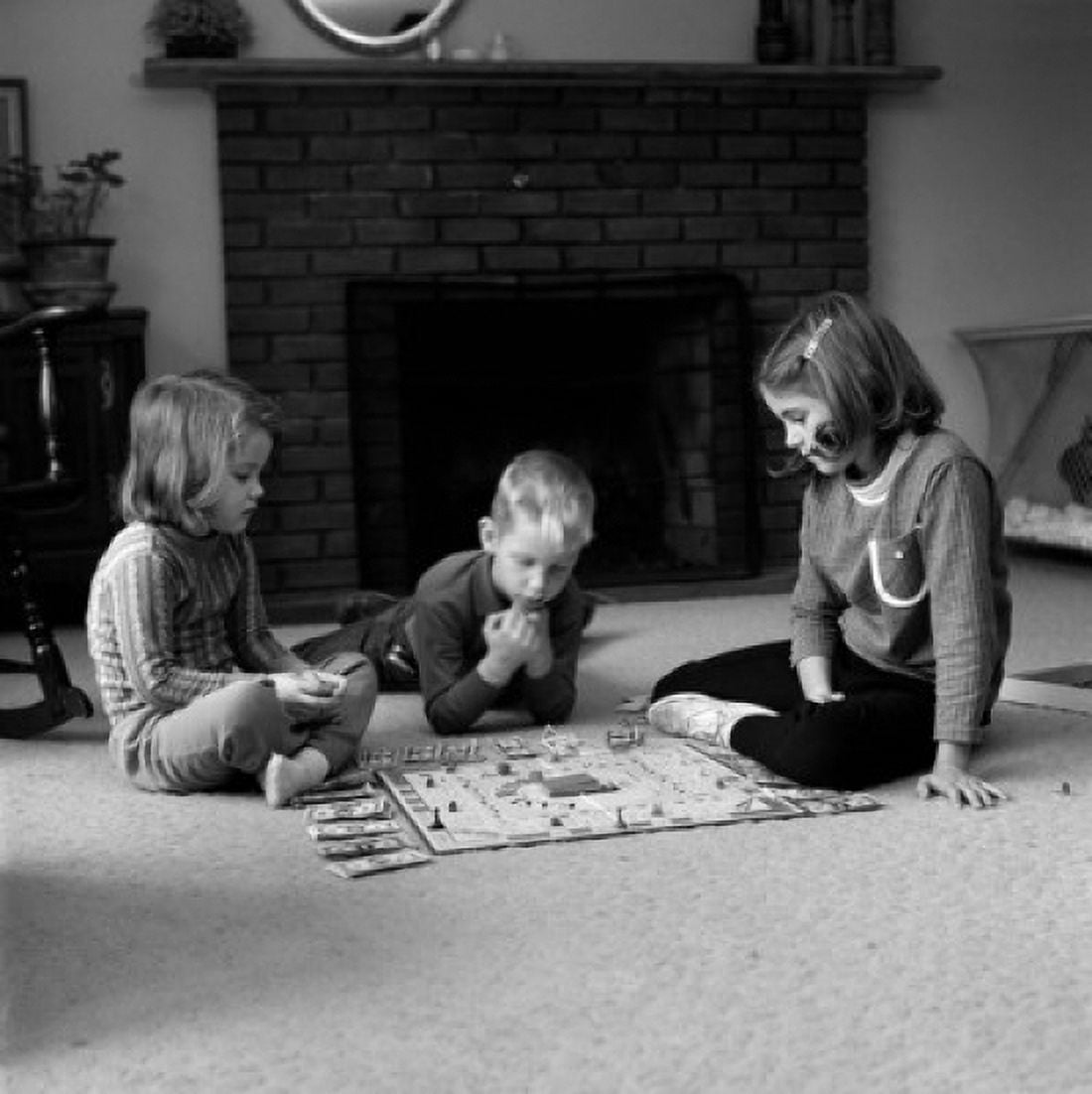 Children playing board game on carpet Canvas Art - (24 x 36)