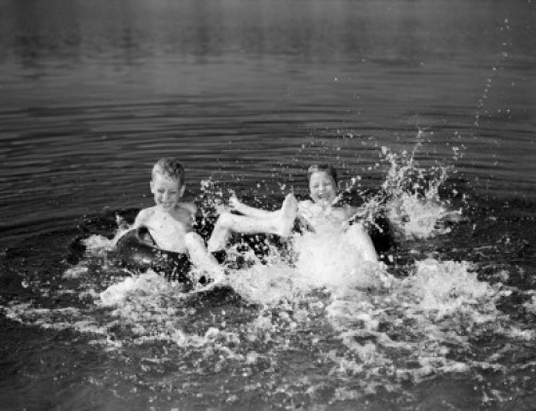 Children playing in water Canvas Art - (18 x 24)
