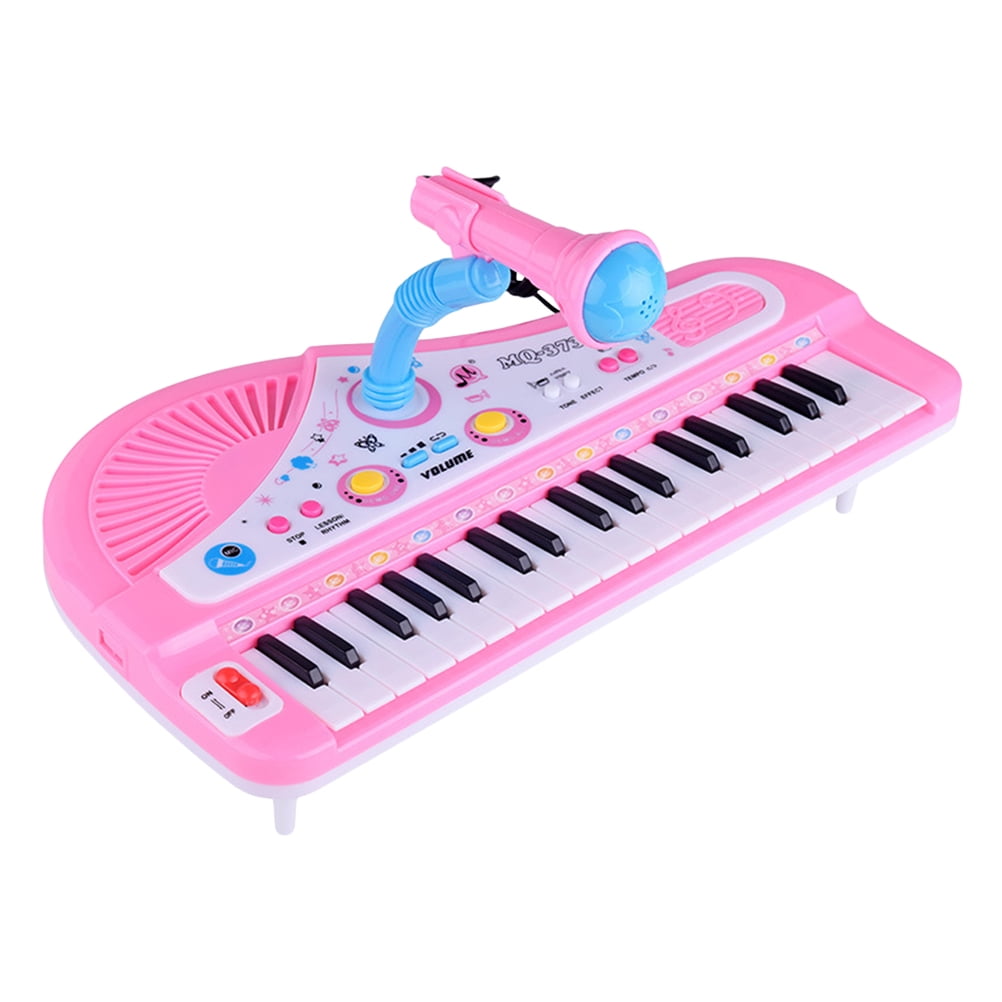 Pink toy piano with cheap microphone