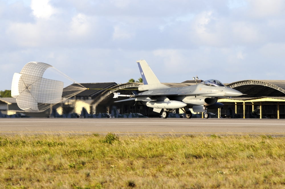 Chilean Air Force F-16A landing with parachute brake at Natal Air Force Base Canvas Art - Riccardo NiccoliStocktrek Images (34 x 23)