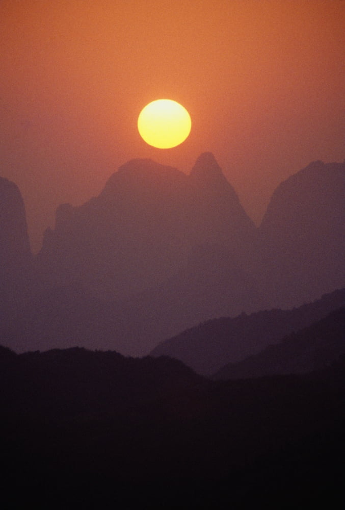 China Guilin Golden Sunball Over Piled Silk Mountains Orange And Pink Misty Sunset Canvas Art - Joe Carini Design Pics (11 x 16)