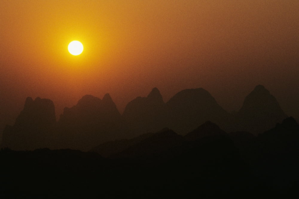 China Guilin Piled Silk Mountains Orange Misty Sunset Canvas Art - Joe Carini Design Pics (17 x 11)