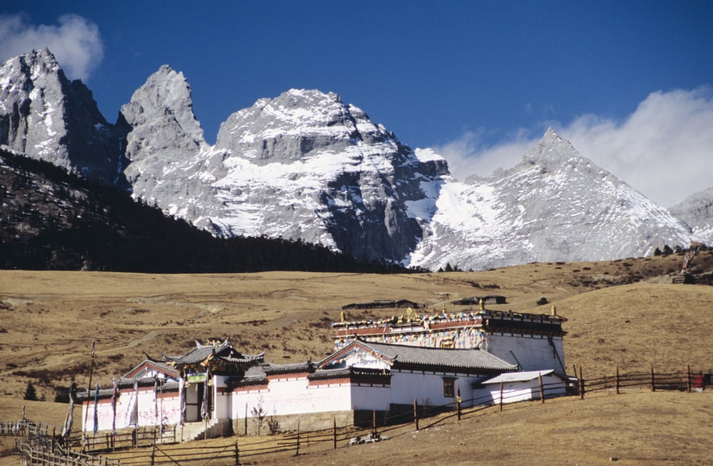 China Jade Dragon Snow Mountain in background Lijiang Old buddhist temple on Yak meadow Canvas Art - Richard Maschmeyer Design Pics (36 x 22)
