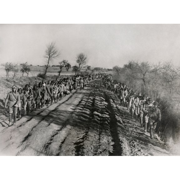 Chinese Civil War 1946-1949. Soldiers Of The Chinese Nationalist Army March Along A Rutted Road In Manchuria. Jan. 29