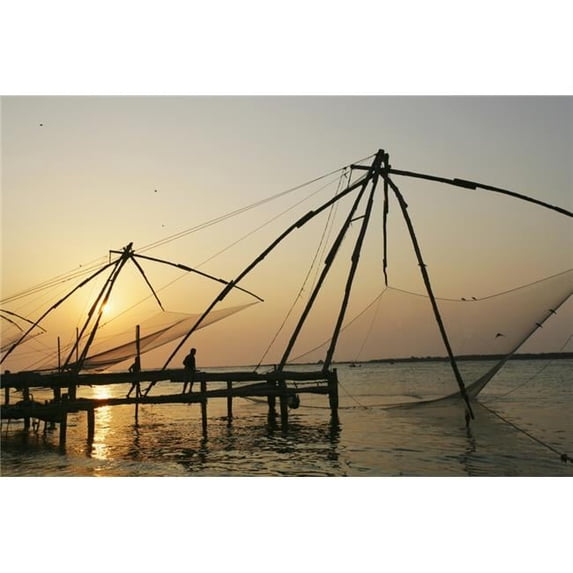 Chinese Fishing Nets Hanging In The Water At Sunset Fort Kochi. Poster Print